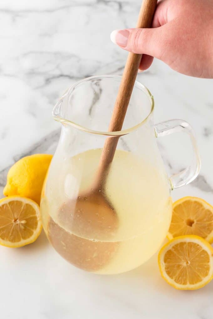mixing pitcher of homemade lemonade