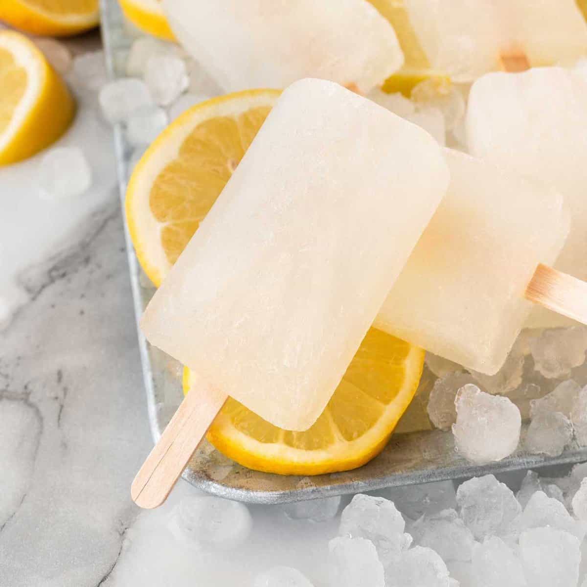 lemon popsicles on tray of ice