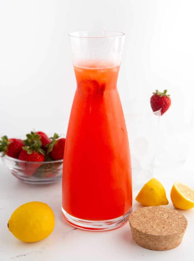 glass pitcher of strawberry lemonade