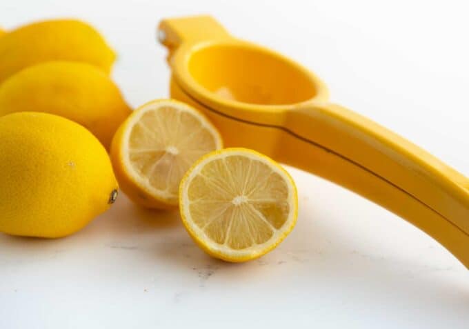 cut lemon with hand juicer