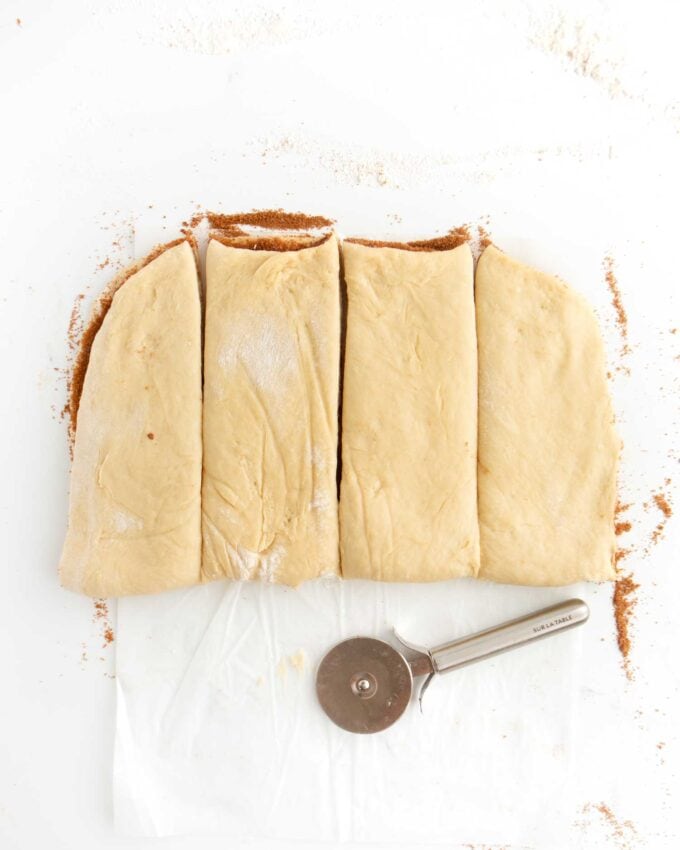 cinnamon roll dough cut in four pieces