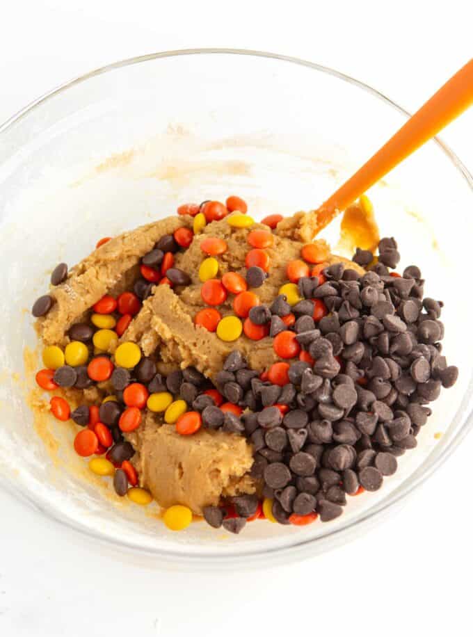 bowl of reeses pieces cookie dough with chocolate chips