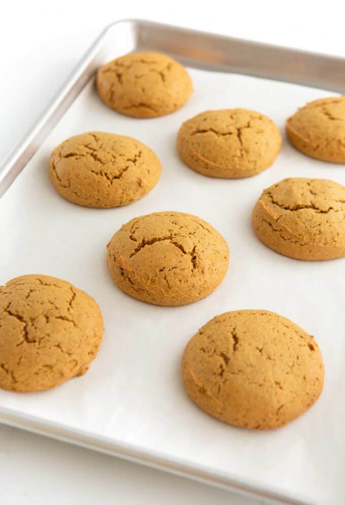 soft pumpkin cookies baked on cookie sheet