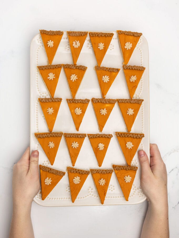tray of sugar cookie bars decorated as slices of pumpkin pie