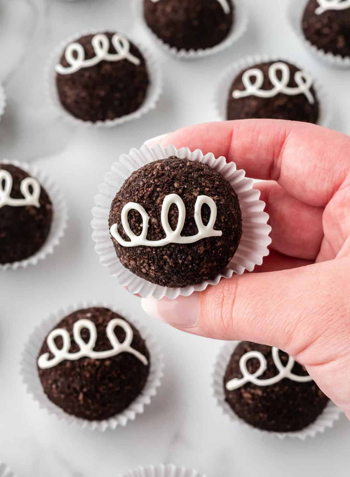 oreo balls without dipping in chocolate, decorated as little debbie cupcakes