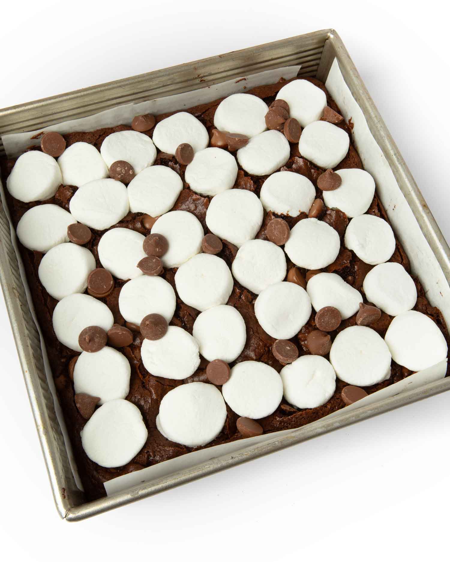 press marshmallow halves into brownies
