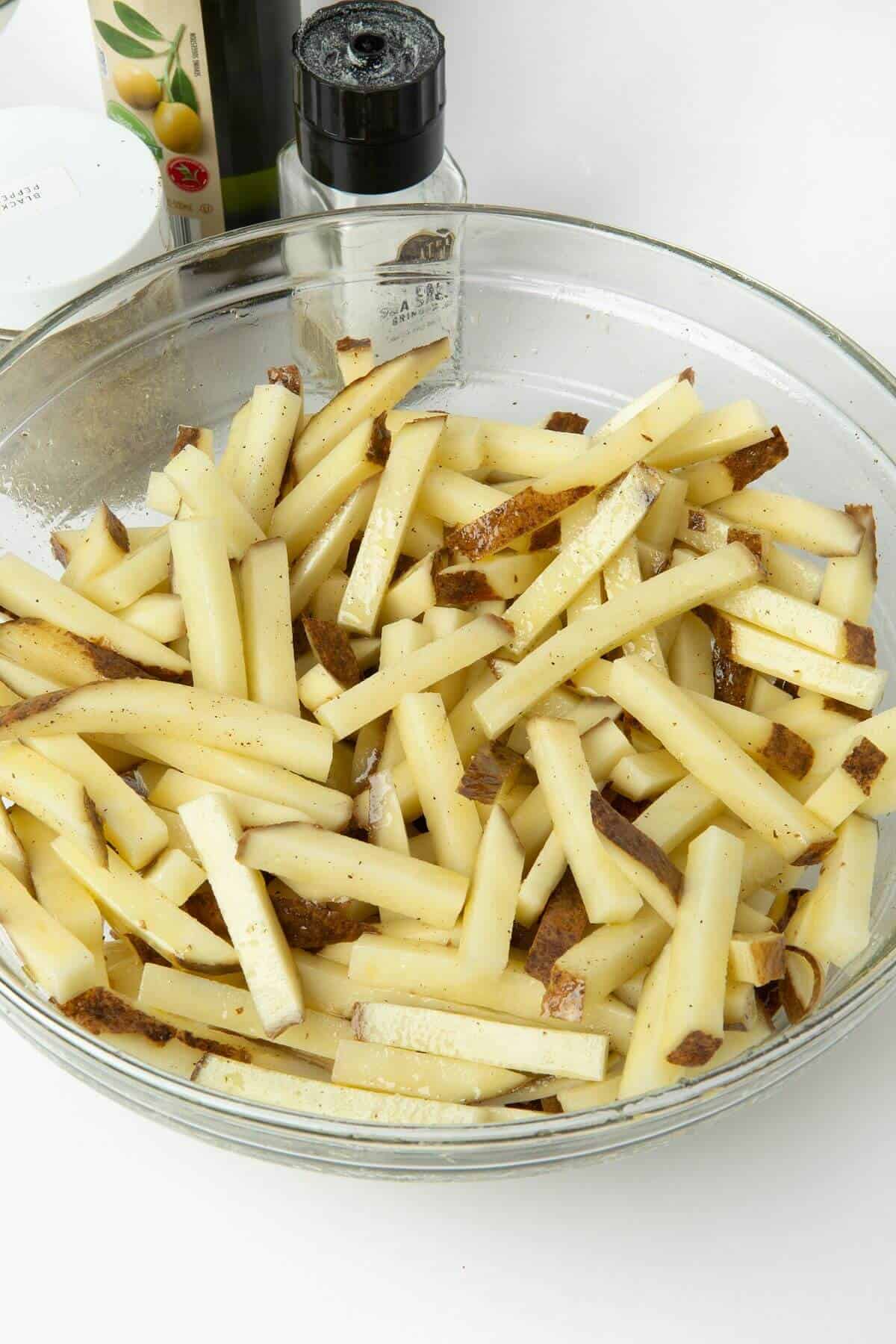 cut potatoes in glass mixing bowl