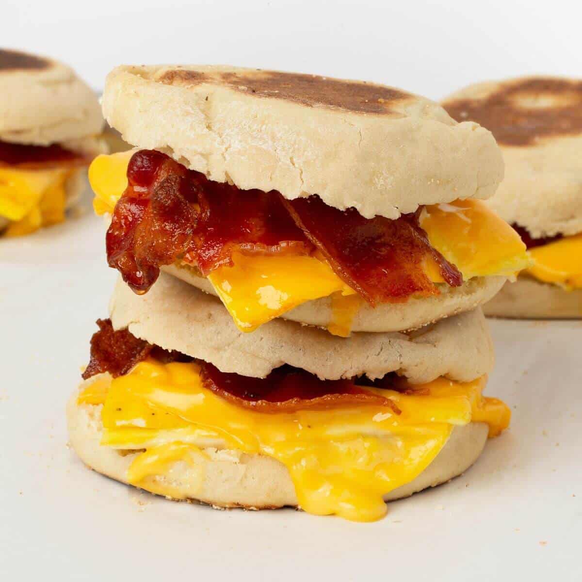 two breakfast sandwiches stacked on top of each other