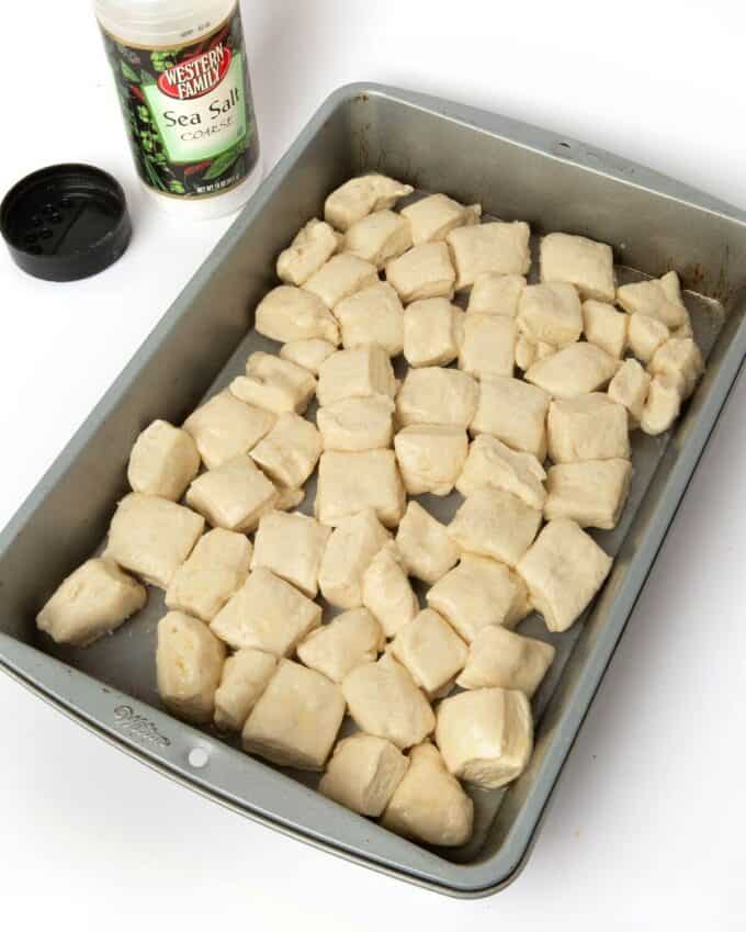 pretzel bite monkey bread dough cubes in pan