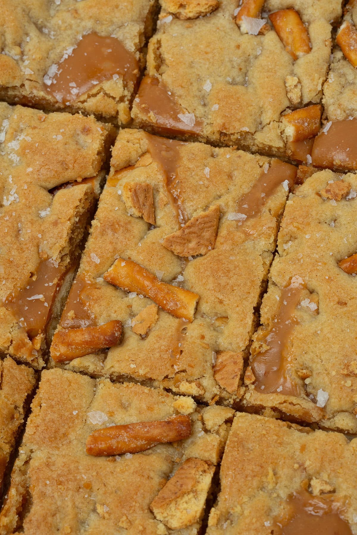 caramel apple kitchen sink cookie bars cut into rectangles