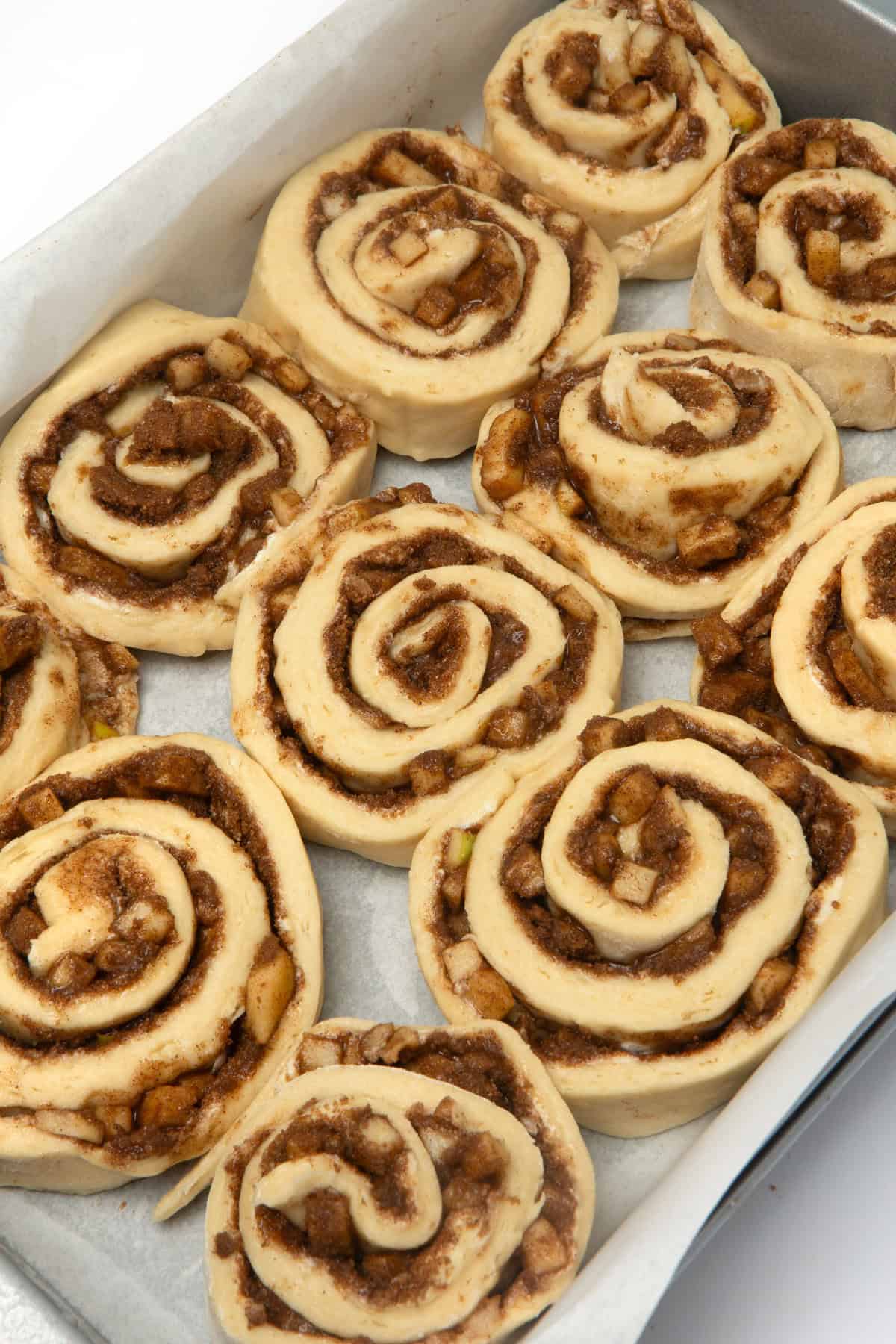 pan of unbaked apple cinnamon rolls
