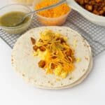 flour tortillas with burrito fillings in the center