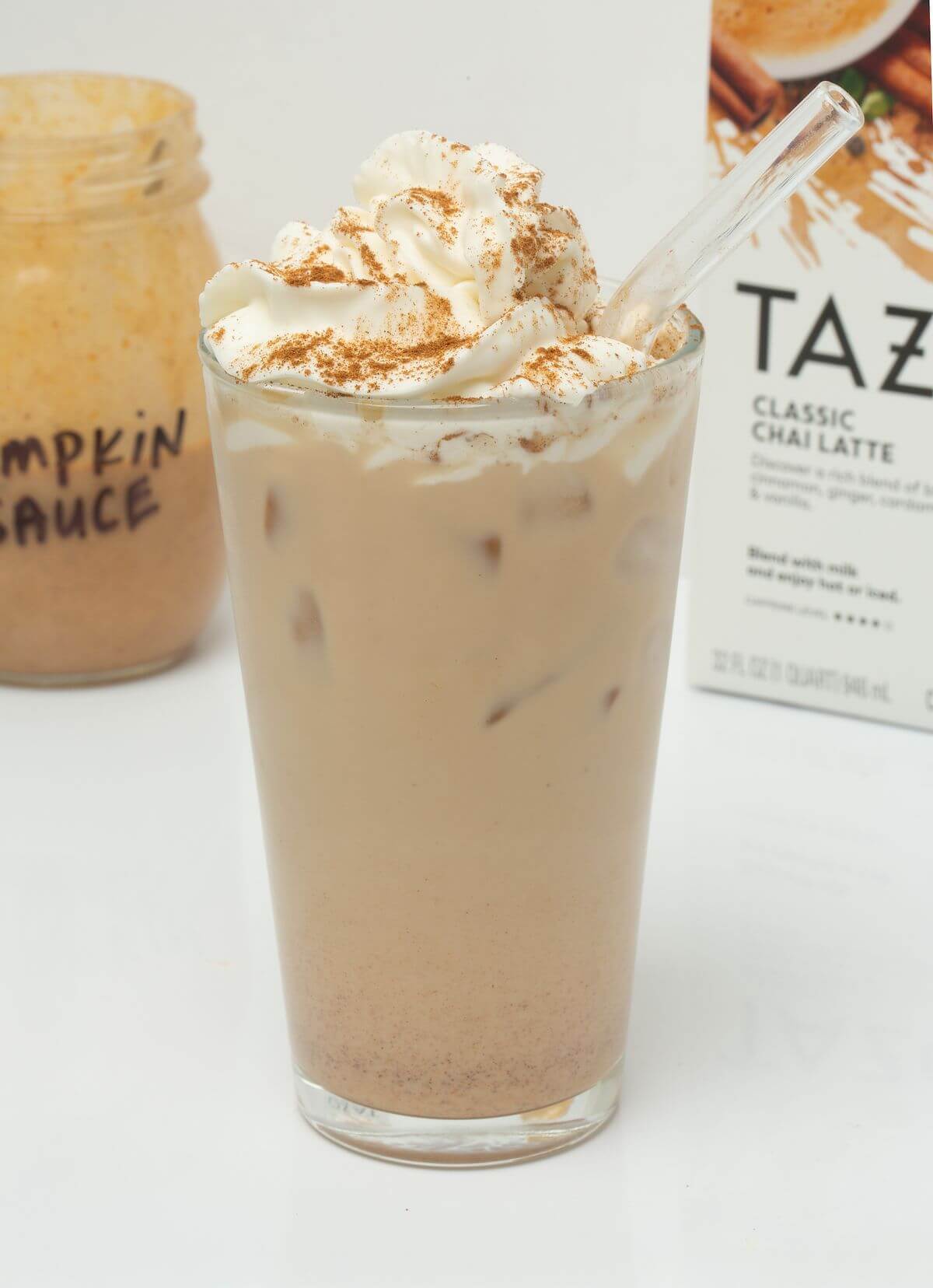 iced pumpkin cream chai with glass straw
