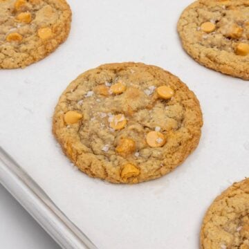 upclose shot of baked oatmeal scotchie on parchment-lined baking sheet