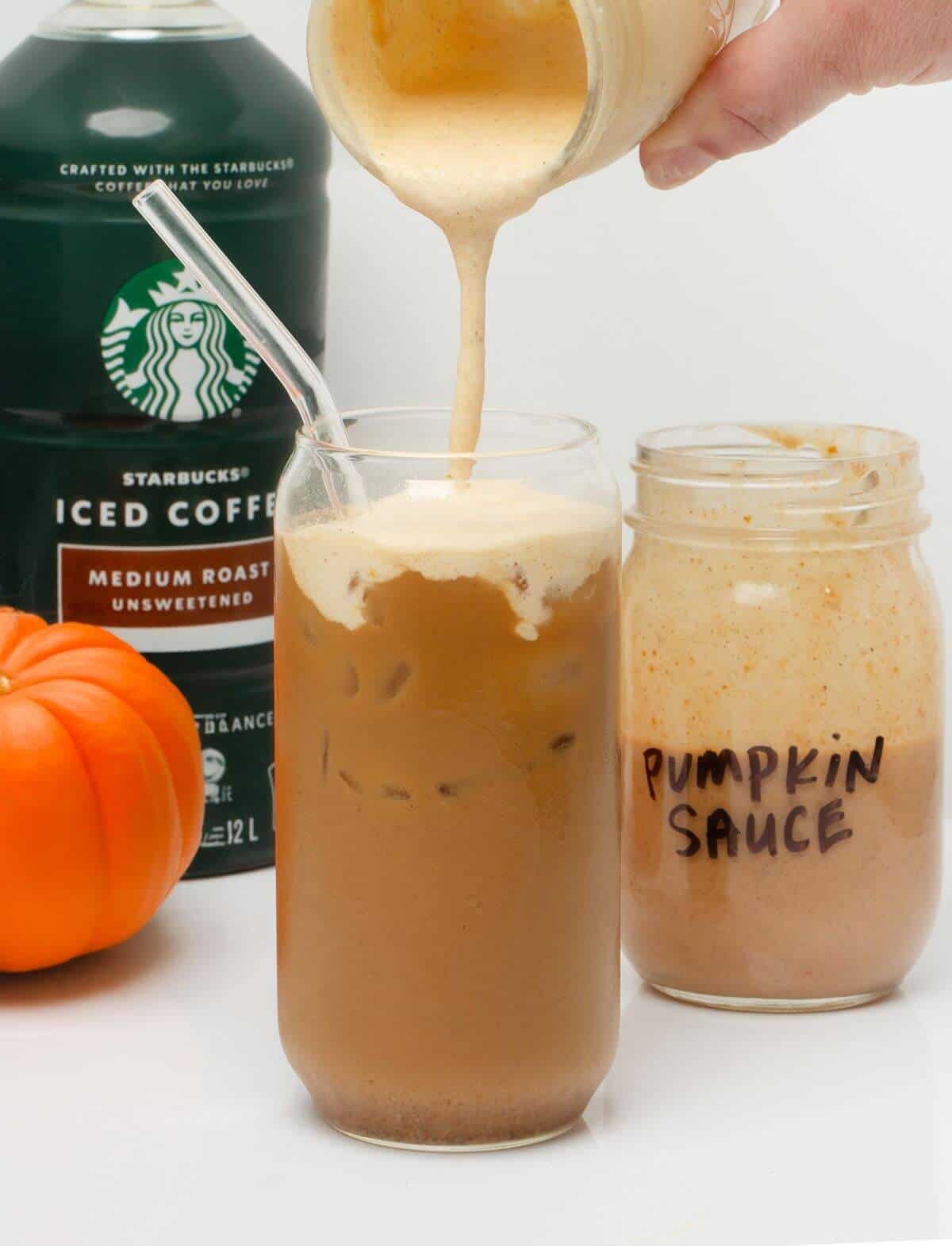 adding pumpkin cold foam made with pumpkin sauce to pumpkin cream cold brew