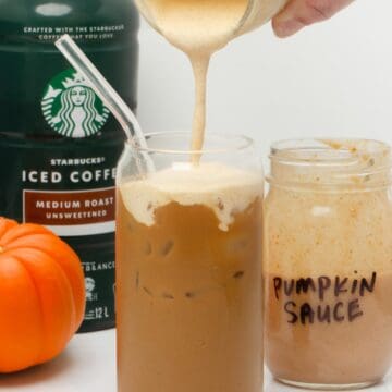 pouring pumpkin cold foam on top of pumpkin cream cold brew