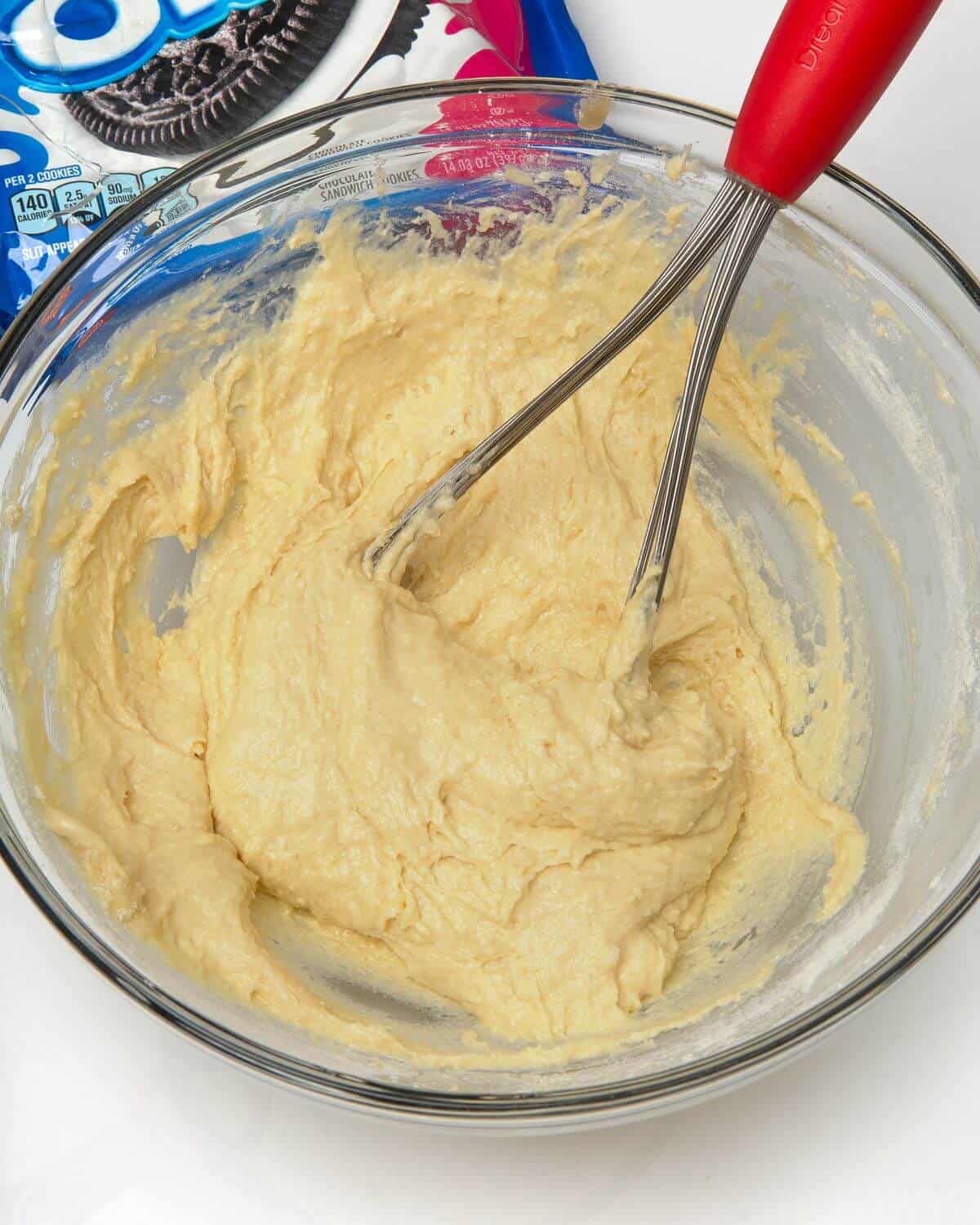 air fried oreo batter mixed in glass bowl with whisk