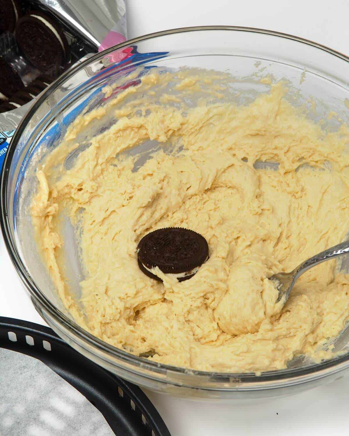 pancake batter in glass mixing bowl with oreo and fork