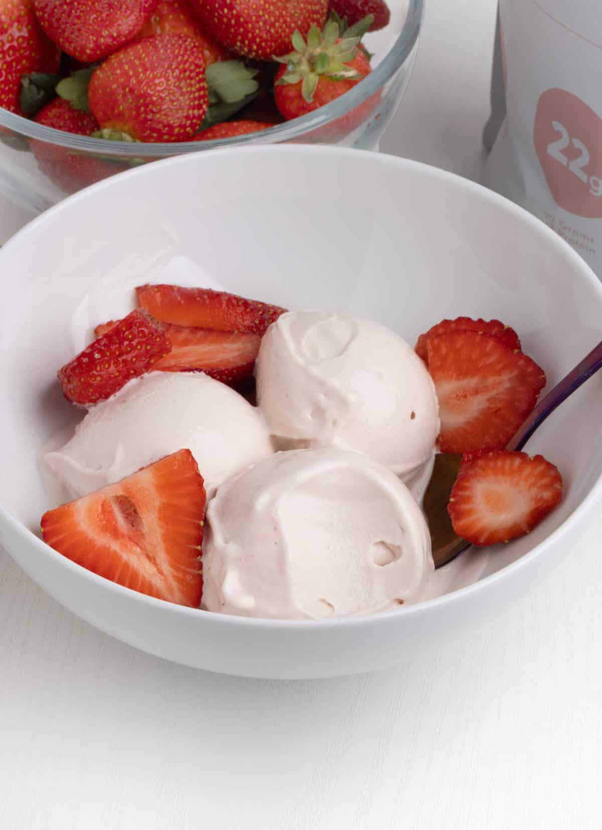 scoops of ninja creami strawberry frozen yogurt