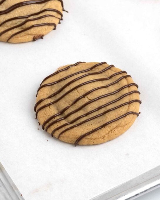 reeses peanut butter cup cookies drizzled with chocolate