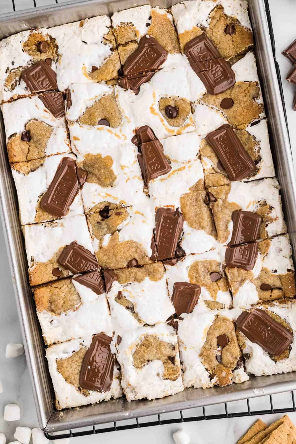 Step 6 - Baked Stuffed S'mores Bars fresh from the oven with Hershey's chocolate pieces pressed on top