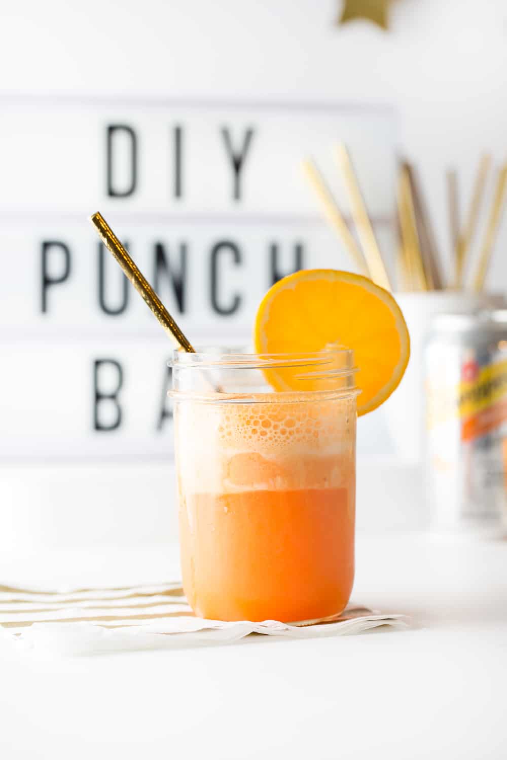 Carbonated Fizzing Orange Sherbet Punch in Glass with Orange Slice for Ultimate DIY Punch Bar