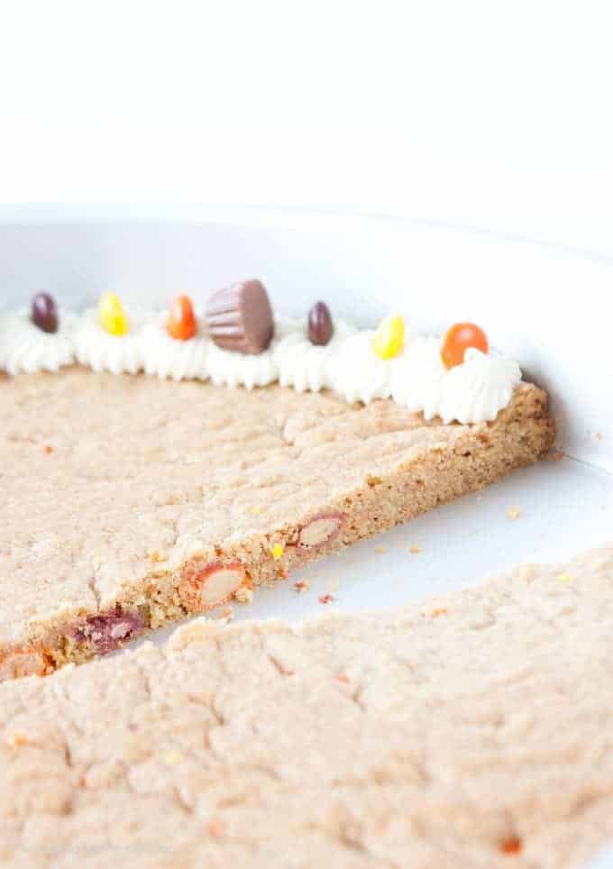 Forget the store bought! This Reeses Peanut Butter Cookie Cake is easy to whip up and just as tasty as its premade competition! Recipe by Design Eat Repeat