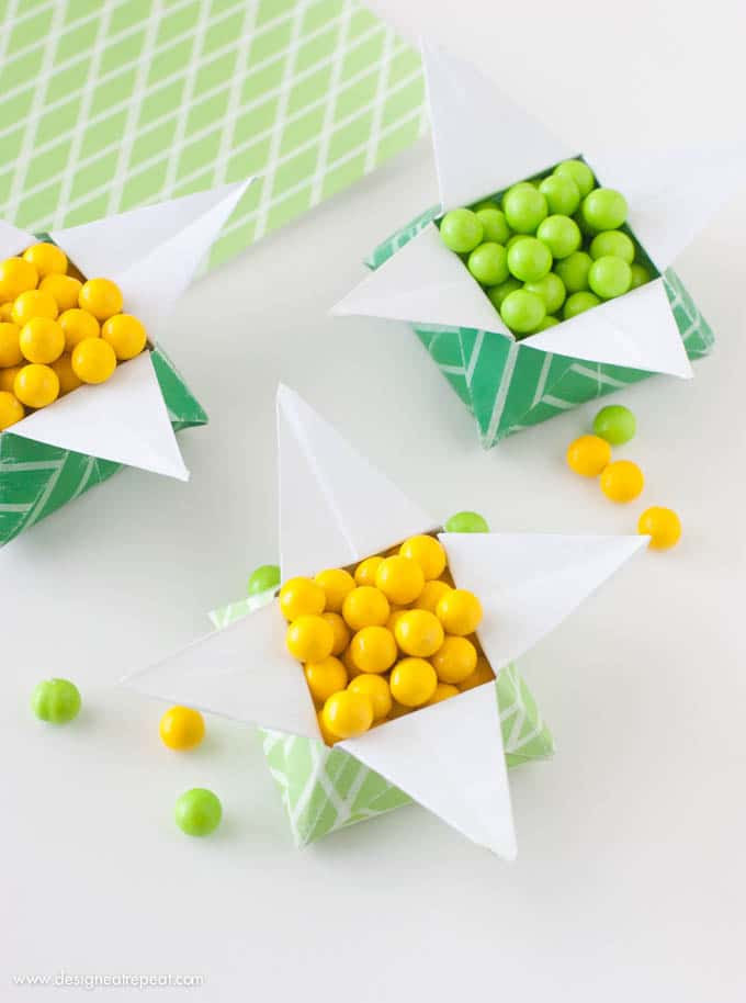 Looking for a quick St. Patrick's Day craft? Print off this FREE paper & follow the tutorial to make a origami "Pot of Gold" box. Fill with candy for a fun project you can make at home!