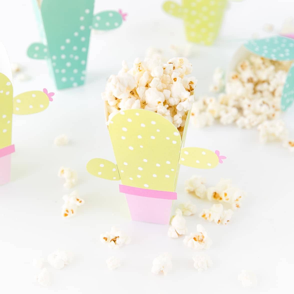 Can these be any cuter?! Cactus popcorn boxes! Get the free popcorn box template at DesignEatRepeat.com | #printable #popcornbox