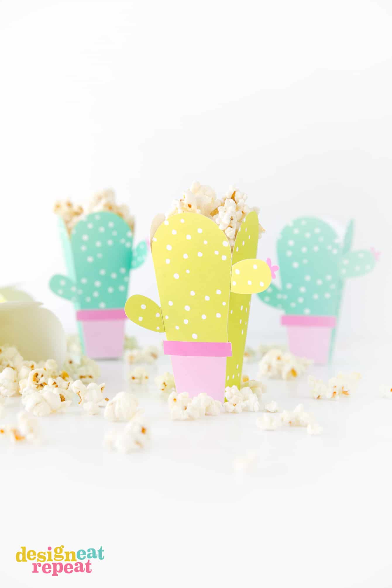 Can these be any cuter?! Cactus popcorn boxes! Get the free popcorn box template at DesignEatRepeat.com | #printable #popcornbox