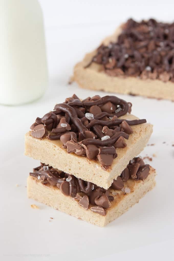 These Salted Chocolate Chip Cookie Bars are the perfect mix of a dense cookie base & a sweet chocolately topping! So good!