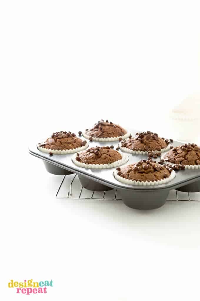 Jumbo cupcake pan filled with six baked chocolate zucchini muffins.