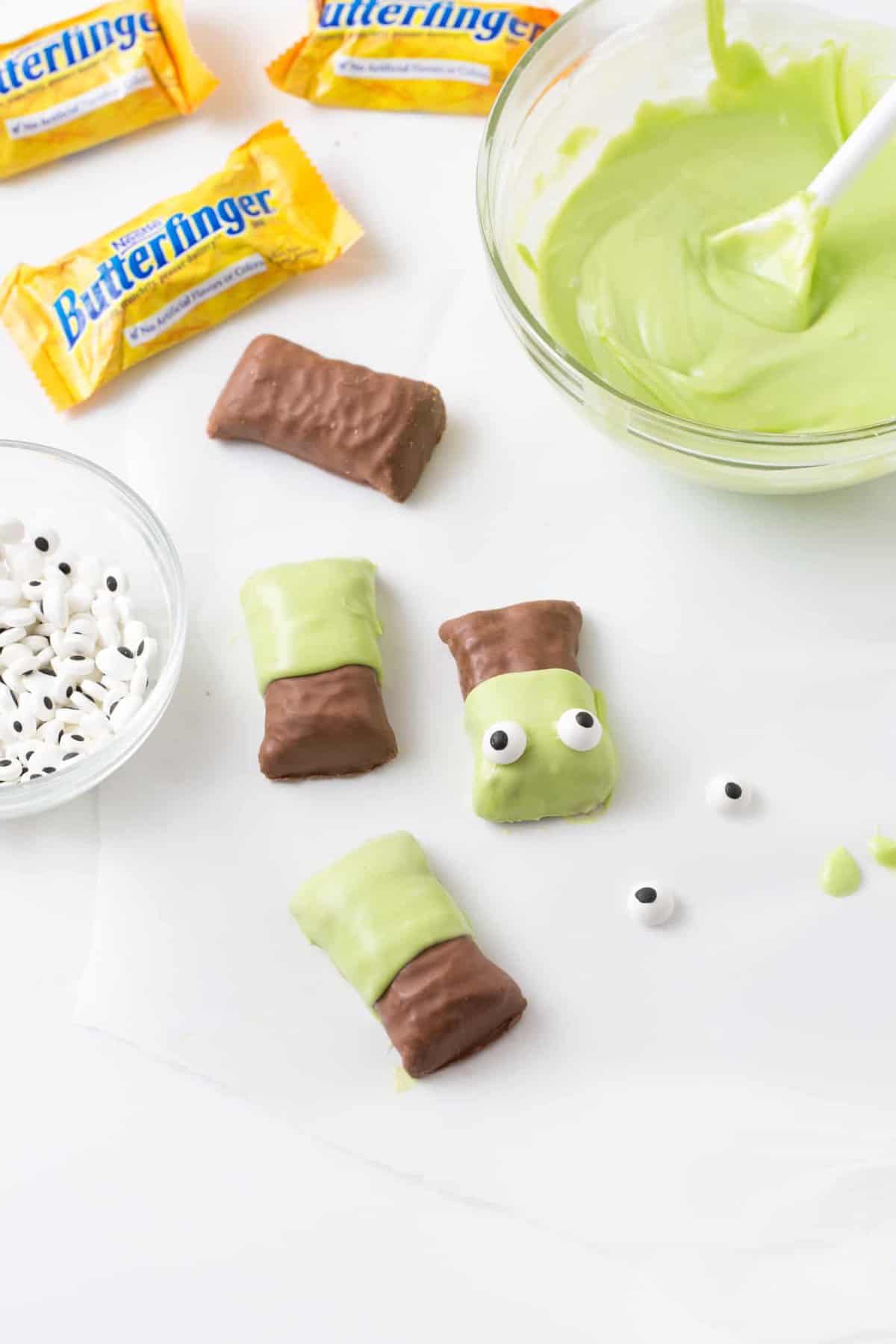 Butterfinger candy bars dipped in melted green almond bark then decorated with candy eyeballs on top to look like Frankenstein.
