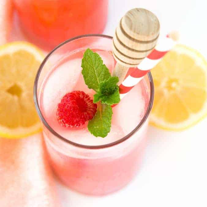 Add pureed raspberries to lemonade for a colorful and refreshing summer drink! Find the recipe for Homemade Raspberry Lemonade at Design Eat Repeat.