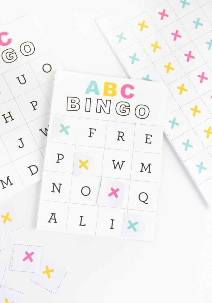 alphabet bingo cards with colorful tokens