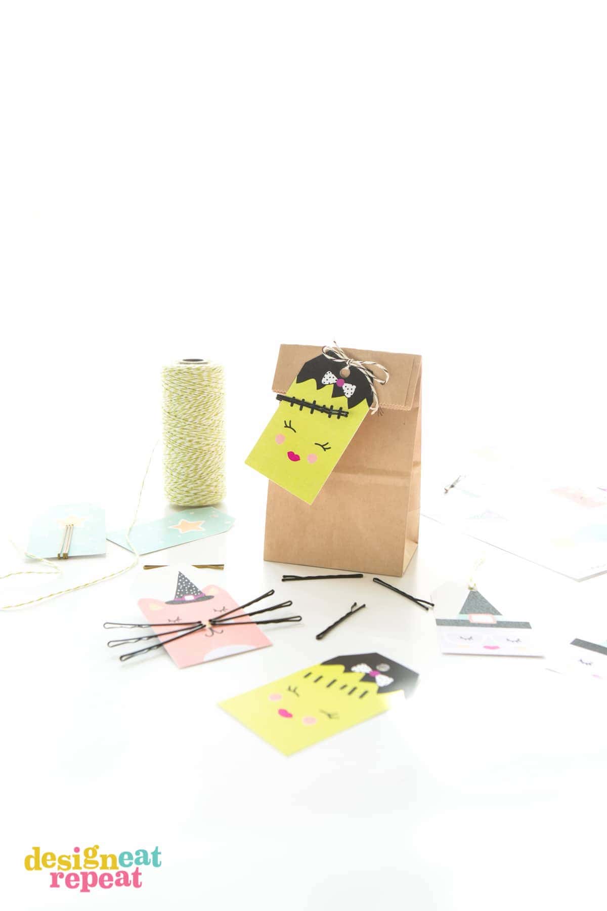 Attach bobby pins to these adorable Halloween tags and help solve the mystery of where the millions of bobby pins across the world disappear to! Download the FREE printable at Design Eat Repeat.