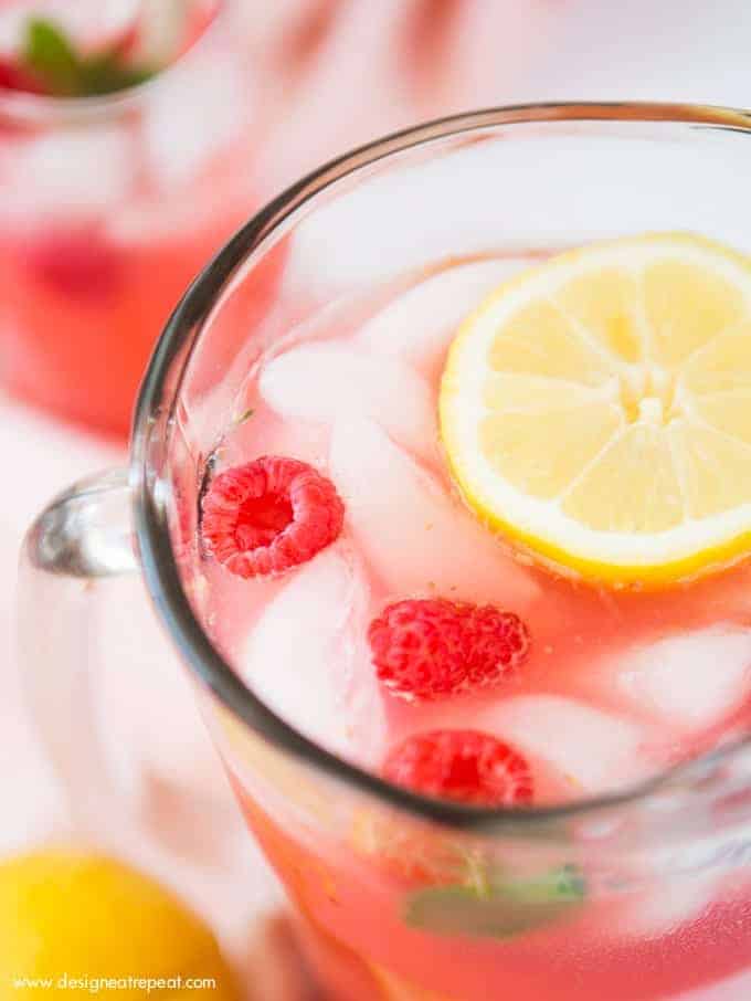 Add pureed raspberries to lemonade for a colorful and refreshing summer drink! Find the recipe for Homemade Raspberry Lemonade at Design Eat Repeat.