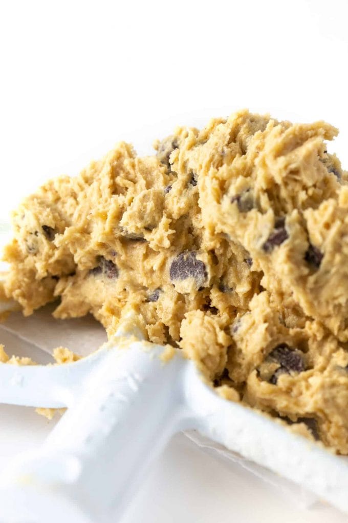 Beater with sticky chewy chocolate chip cookie dough