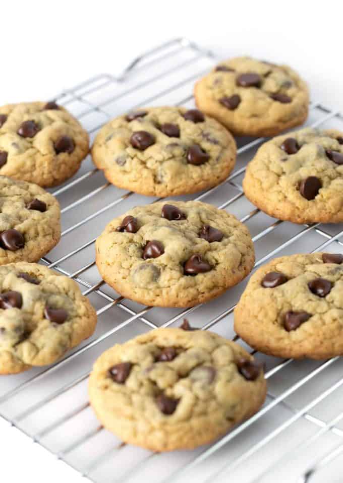 Warm chewy chocolate chip oatmeal cookies on cooling rack