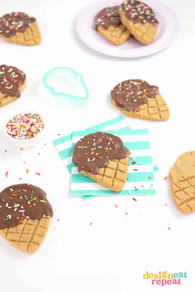 Peanut butter ice cream cookies on striped napkin. Made using Sugarbelle ice cream cone cutter.