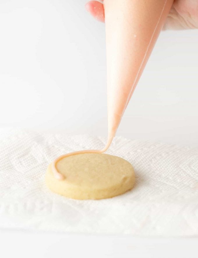 Piping bag with pink and peach Royal Icing for Sugar Cookies