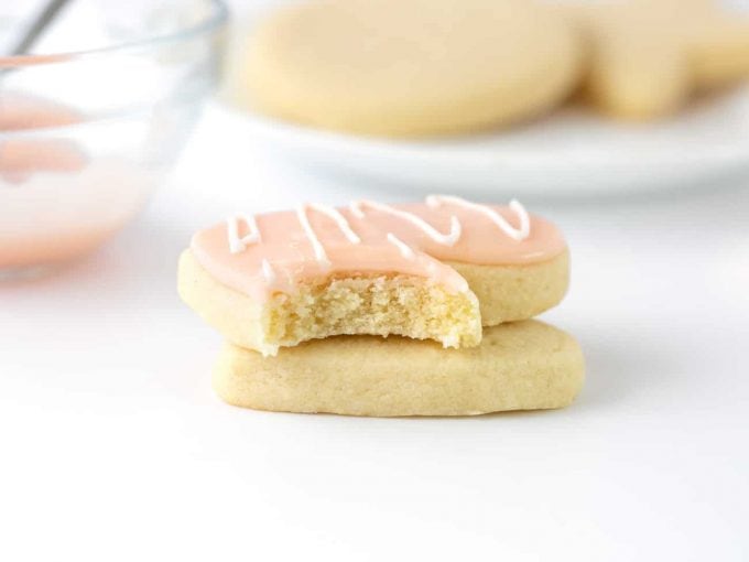 sugar cookie with bite topped with powdered sugar icing for cookies