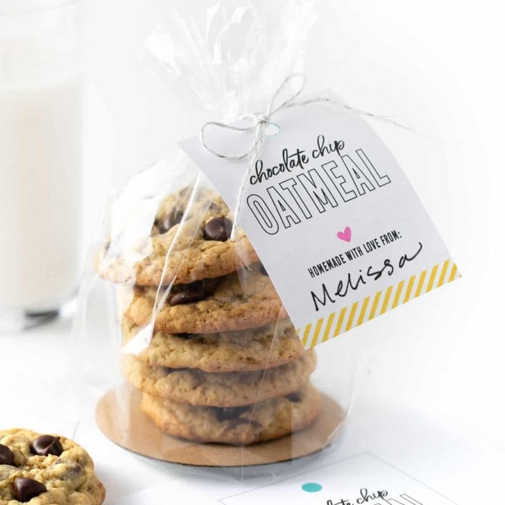 stack of chocolate chip oatmeal cookies packaged in plastic bag with gift tag