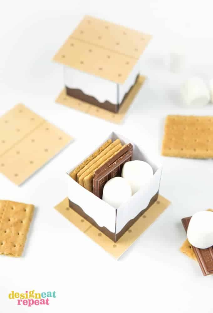 Dive into summer with these FREE S'more Printable Treat Boxes! Perfect for a camping-themed birthday parties, summer barbecues, or just as fun way to spruce up a night of indoor microwave s'mores!