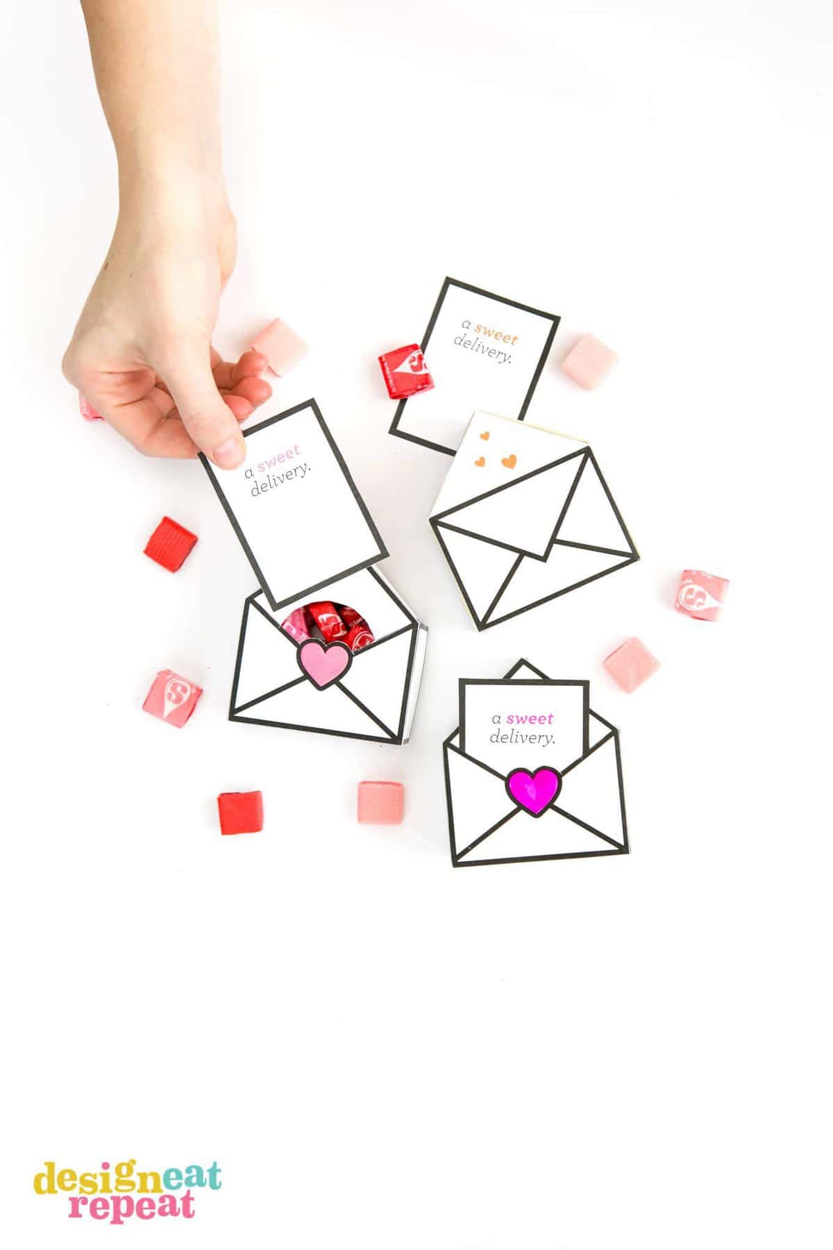 Printable Valentines gift boxes that are designed like envelopes with a sweet delivery notecard filled with Starburst.