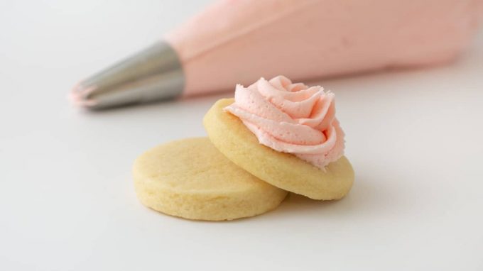 Pink sugar cookie buttercream on cookie