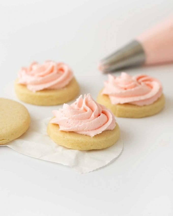 Pink sugar cookie buttercream on cookie