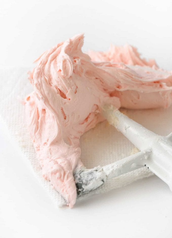 Pink buttercream frosting on kitchenaid paddle