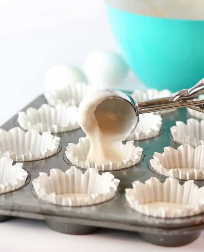 Scooping batter into cupcake pan for white wedding cupcakes