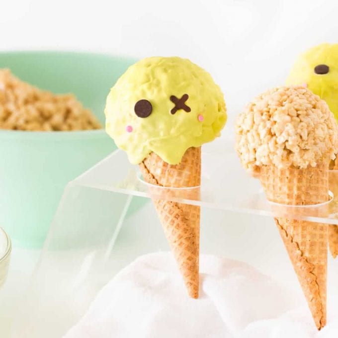 Rice krispie treats in ice cream cones decorated like zombie